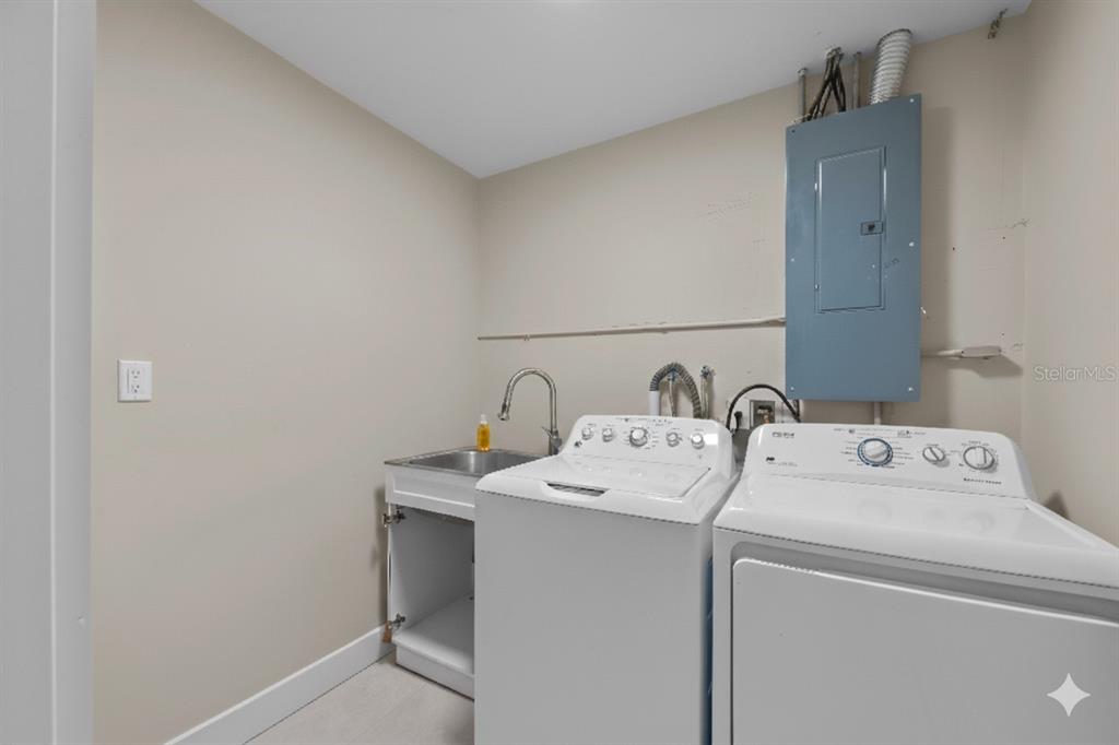 8552 Lagoon Road Fort Myers Beach, FL 33931 - Photo 17 of 33 a utility room with dryer and washer