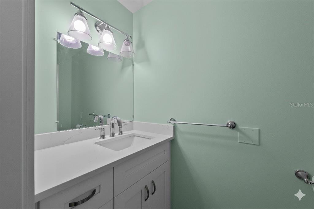 8552 Lagoon Road Fort Myers Beach, FL 33931 - Photo 18 of 33 a bathroom with a sink and a mirror