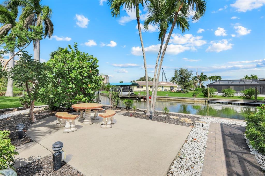 8552 Lagoon Road Fort Myers Beach, FL 33931 - Photo 24 of 33 a view of swimming pool with a table and chairs