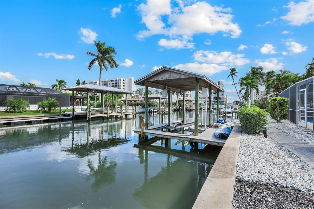 8552 Lagoon Road Fort Myers Beach, FL 33931 - Photo 26 of 33 a view of a lake with a table and chairs