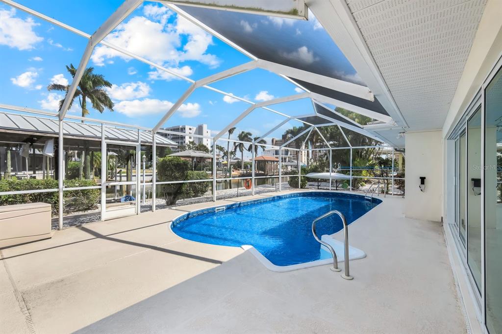 8552 Lagoon Road Fort Myers Beach, FL 33931 - Photo 28 of 33 a view of a swimming pool with a patio