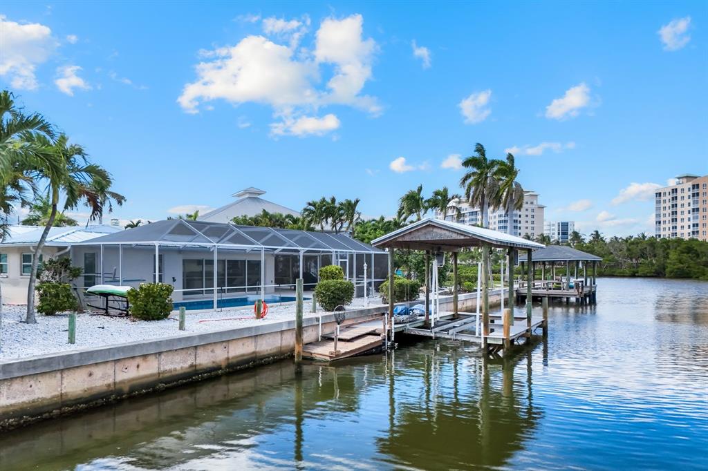 8552 Lagoon Road Fort Myers Beach, FL 33931 - Photo 29 of 33 a view of a lake with a table and chairs