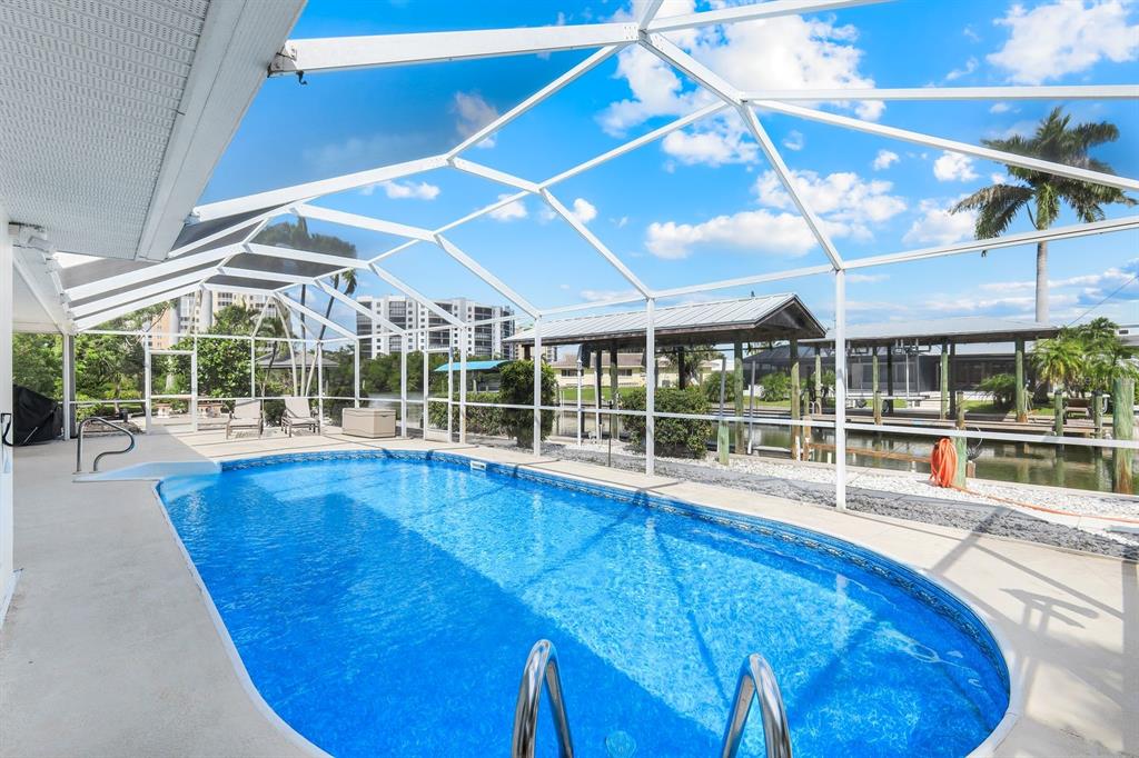 8552 Lagoon Road Fort Myers Beach, FL 33931 - Photo 3 of 33 a view of a swimming pool with a patio