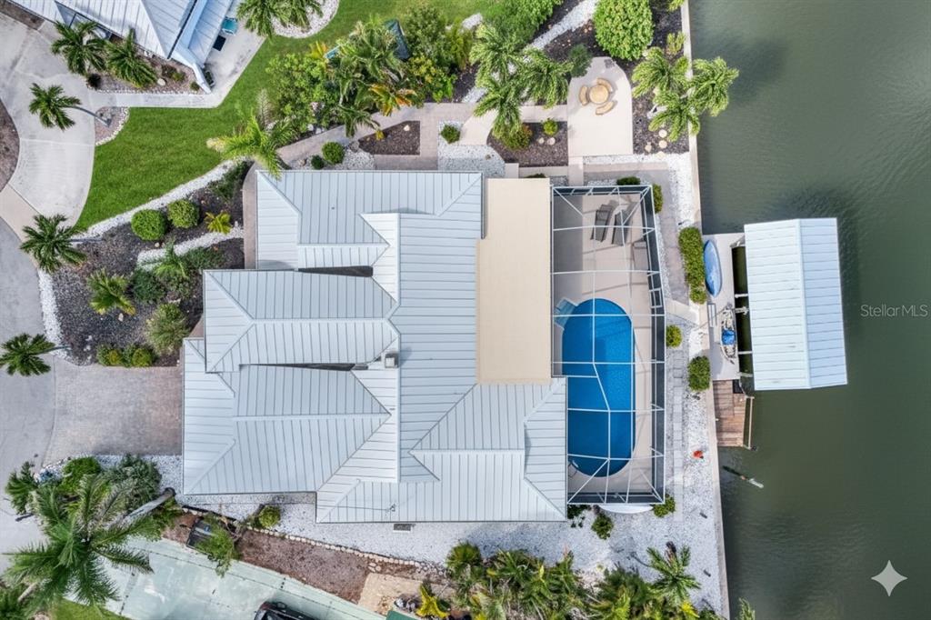 8552 Lagoon Road Fort Myers Beach, FL 33931 - Photo 33 of 33 a aerial view of a house with a yard and garden