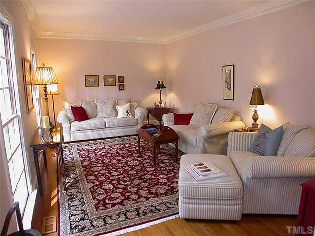 10769 Trego Trail Raleigh, NC 27614 - Photo 4 of 25 Spacious formal living room features custom moldings, hardwood floors and smooth 9' ceilings.