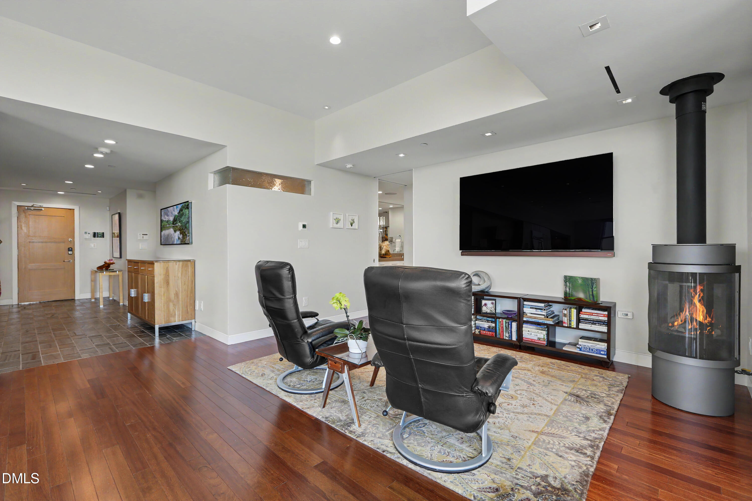 331 West Barbee Chapel Road Chapel Hill, NC 27517 - Photo 32 of 92 a living room with furniture and a flat screen tv