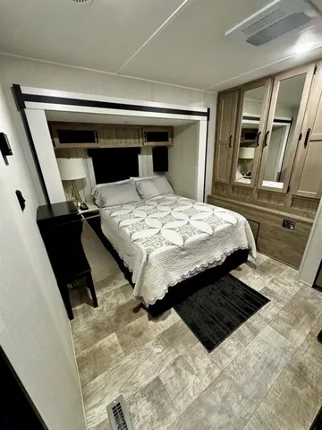 a bedroom with bed and window