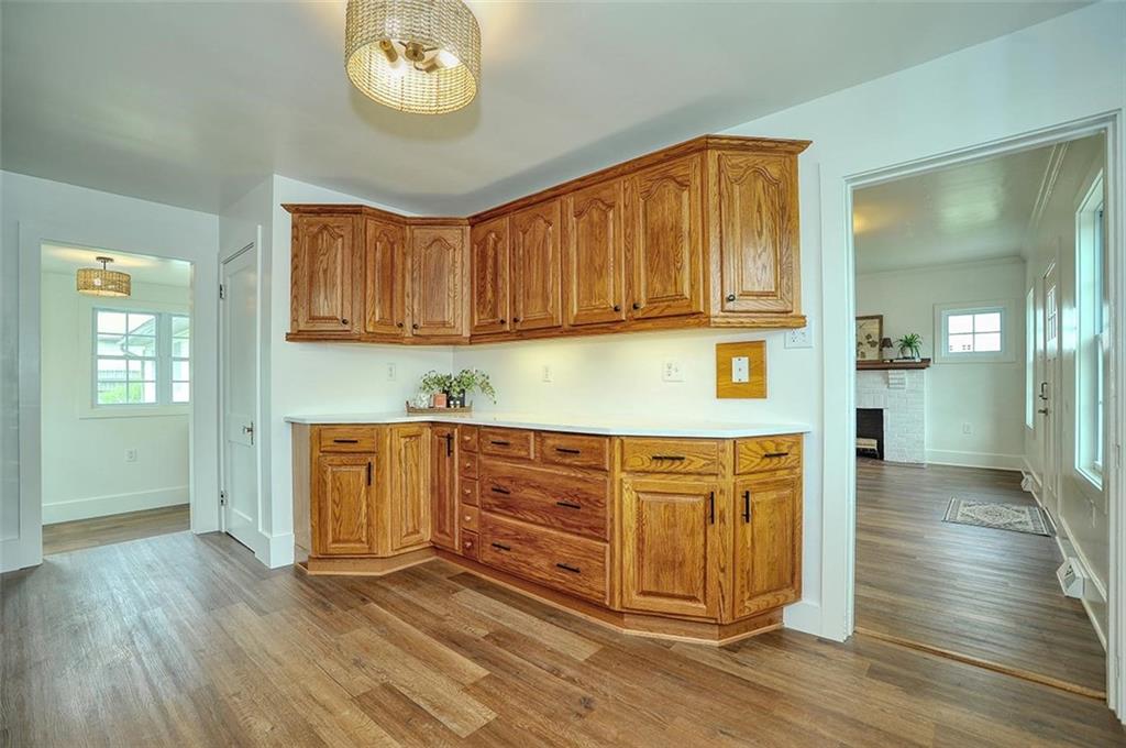 113 3rd Street Houston, PA 15342 - Photo 8 of 27 a kitchen with stainless steel appliances granite countertop a stove a sink and a refrigerator with wooden floors