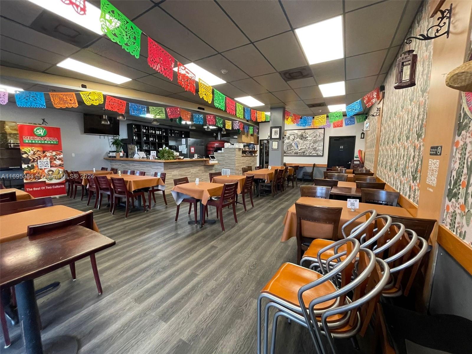 12388 Southwest 127th Avenue Miami, FL 33186 - Photo 19 of 28 a view of a chairs and tables in a patio