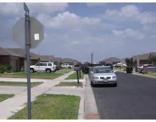 a view of cars parked in front of a building