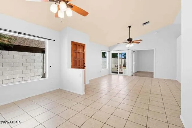 a view of an empty room with a window