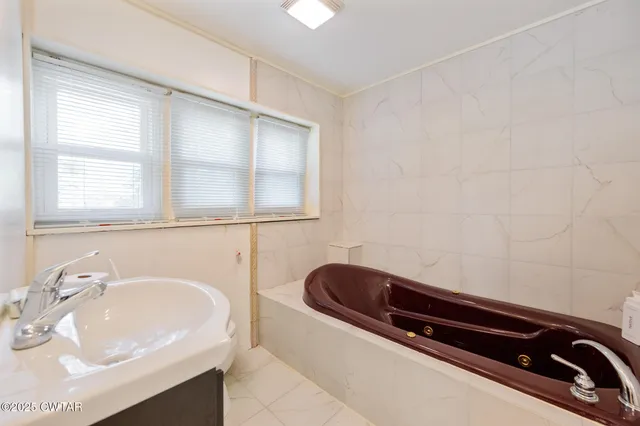 a bathroom with a sink and a bathtub