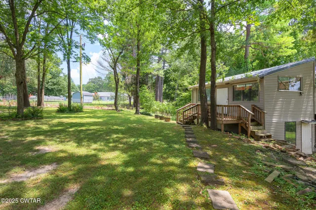 a view of a house with a big yard