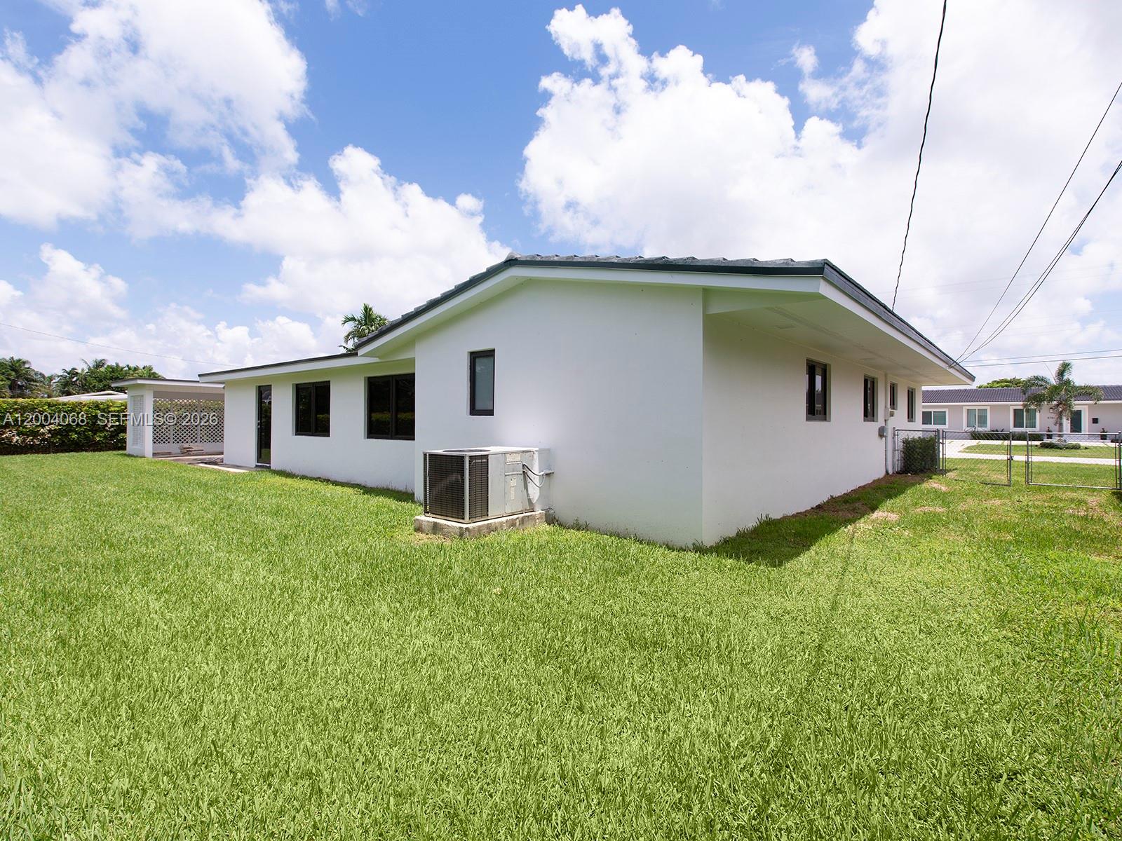 8790 Southwest 85th Street Miami, FL 33173 - Photo 11 of 20 a front view of house with yard and trees