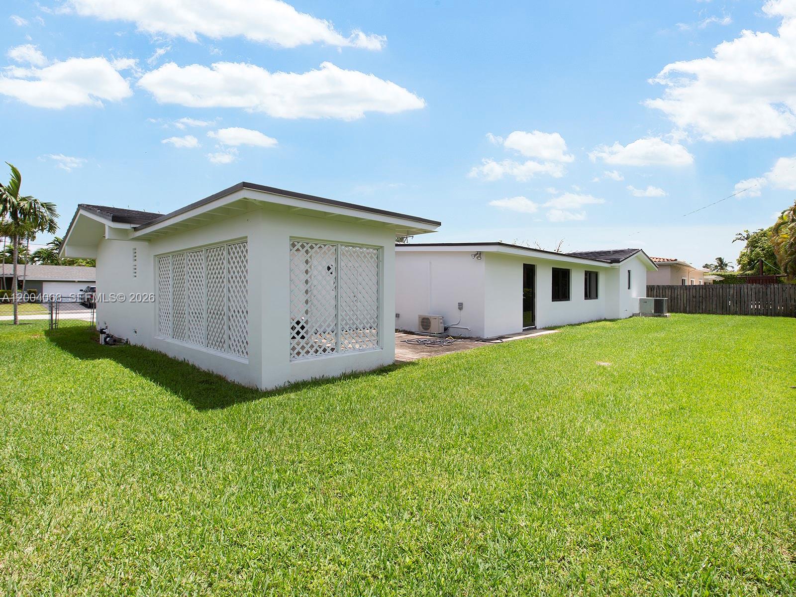 8790 Southwest 85th Street Miami, FL 33173 - Photo 12 of 20 a view of a house with a yard