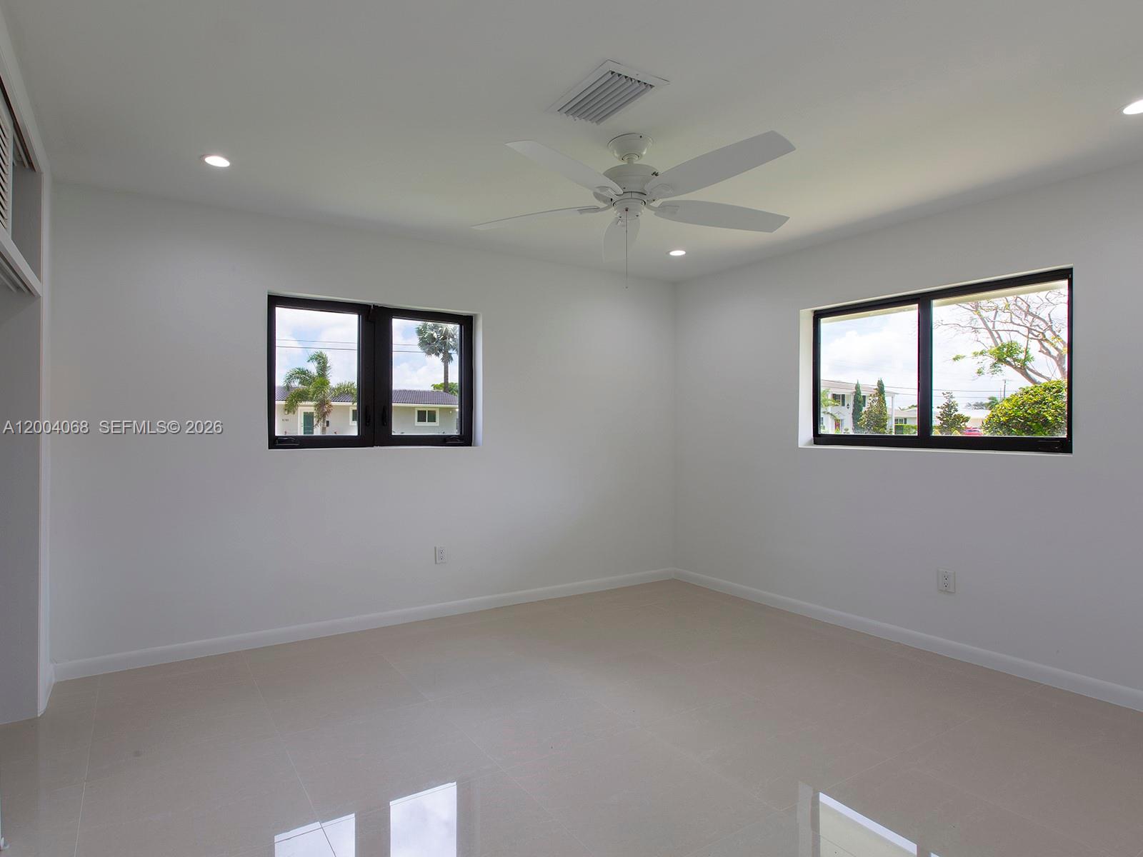 8790 Southwest 85th Street Miami, FL 33173 - Photo 15 of 20 an empty room with windows