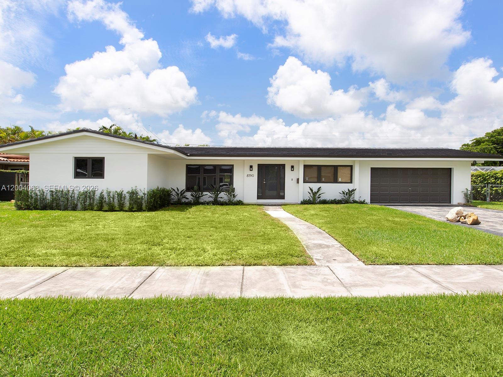 8790 Southwest 85th Street Miami, FL 33173 - Photo 2 of 20 a view of house that has garden