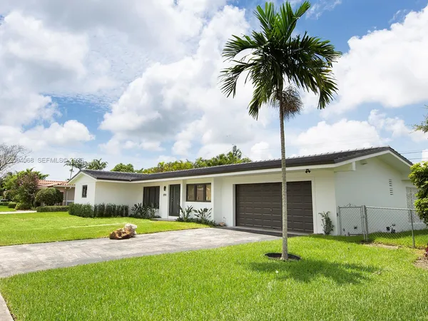 a front view of house with yard and porch