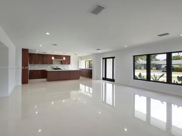 a view of a living room with a large window