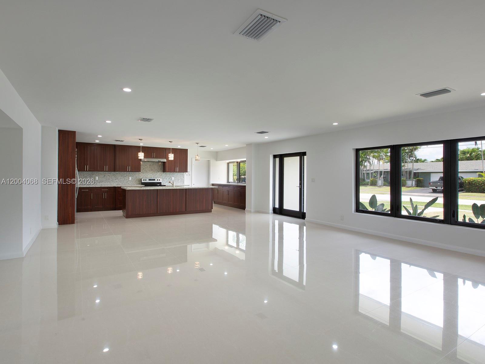 8790 Southwest 85th Street Miami, FL 33173 - Photo 4 of 20 a view of a living room with a large window