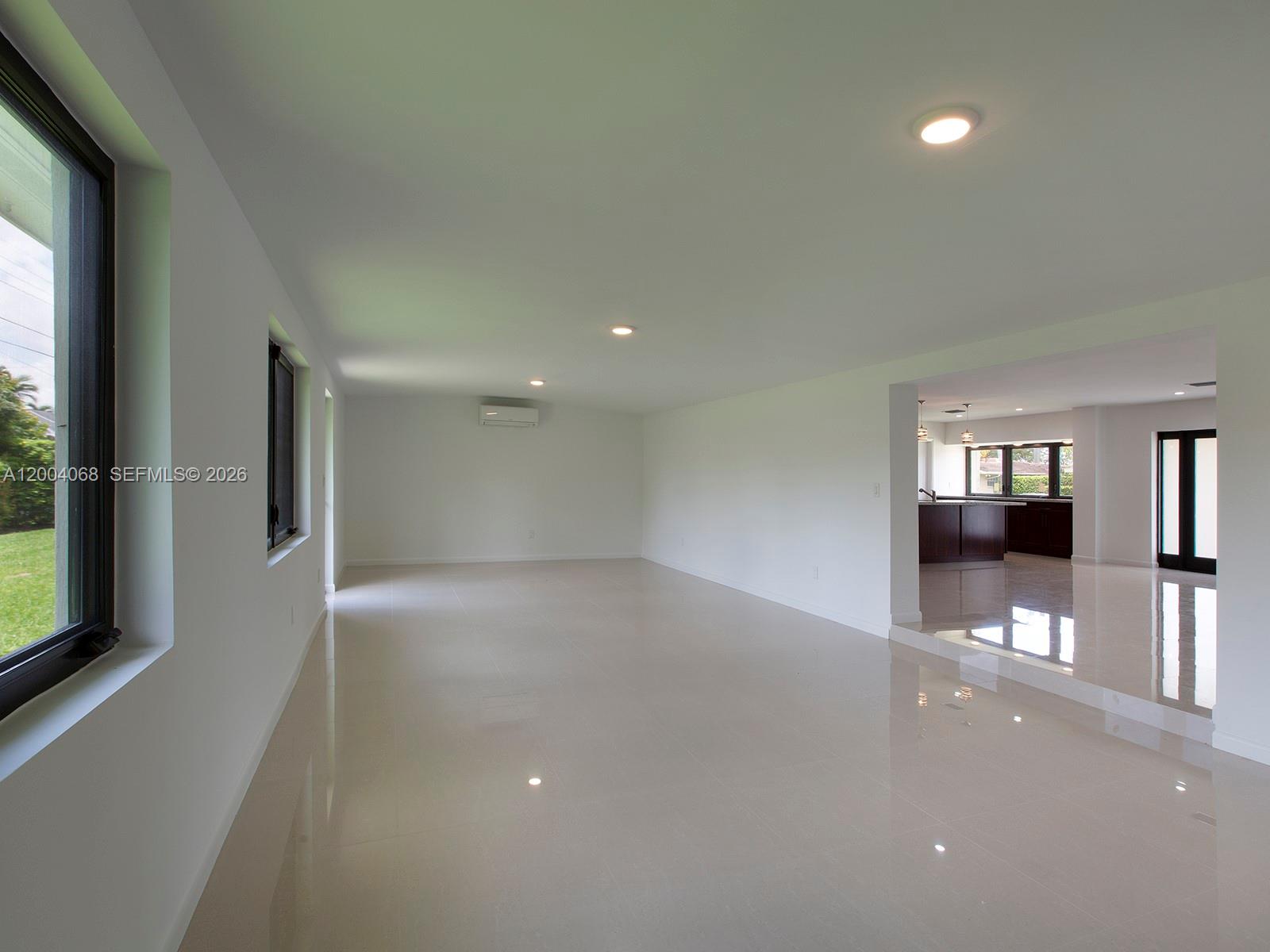 8790 Southwest 85th Street Miami, FL 33173 - Photo 9 of 20 an empty room with large windows and entrance