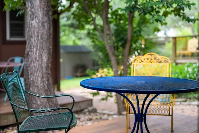 a view of balcony with wooden floor and outdoor seating