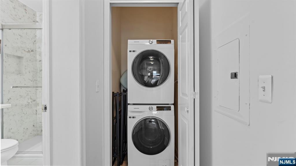 344 The Promenade, Unit 344 Edgewater, NJ 07020 - Photo 19 of 44 a utility room with dryer and washer