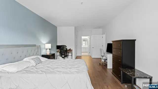 a bed room with bed and television