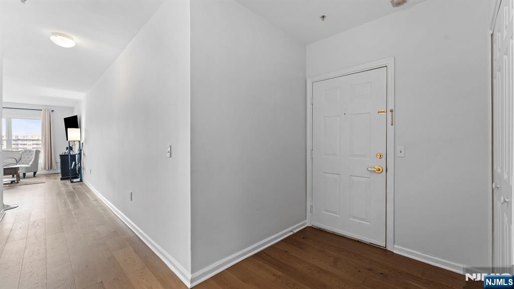 344 The Promenade, Unit 344 Edgewater, NJ 07020 - Photo 31 of 44 a view of hallway with wooden floor