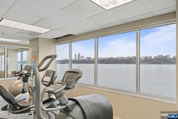 a room with gym equipment and a large window