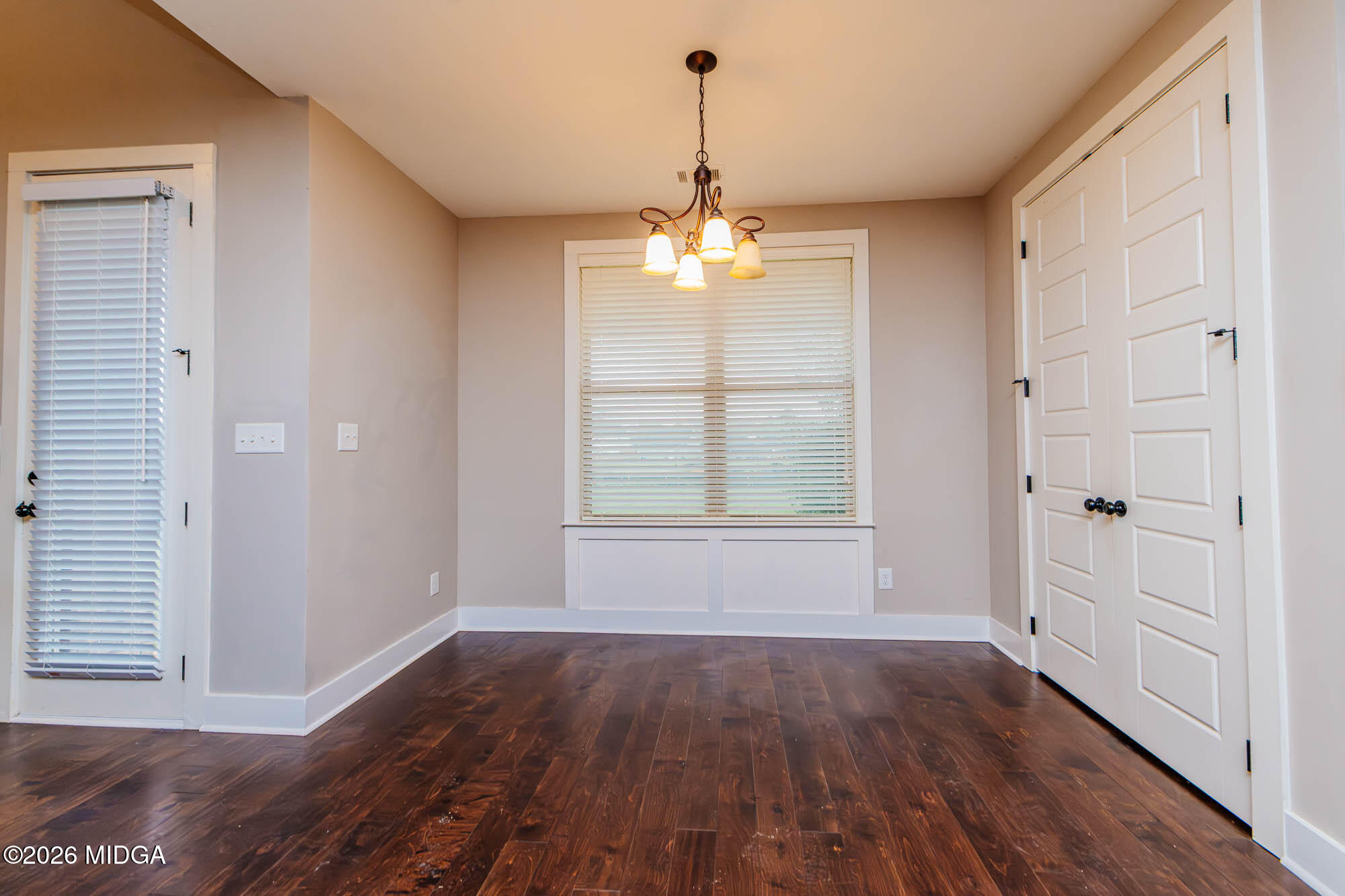 112 Agriculture Lane Perry, GA 31069 - Photo 15 of 40 wooden floor in an empty room with a window