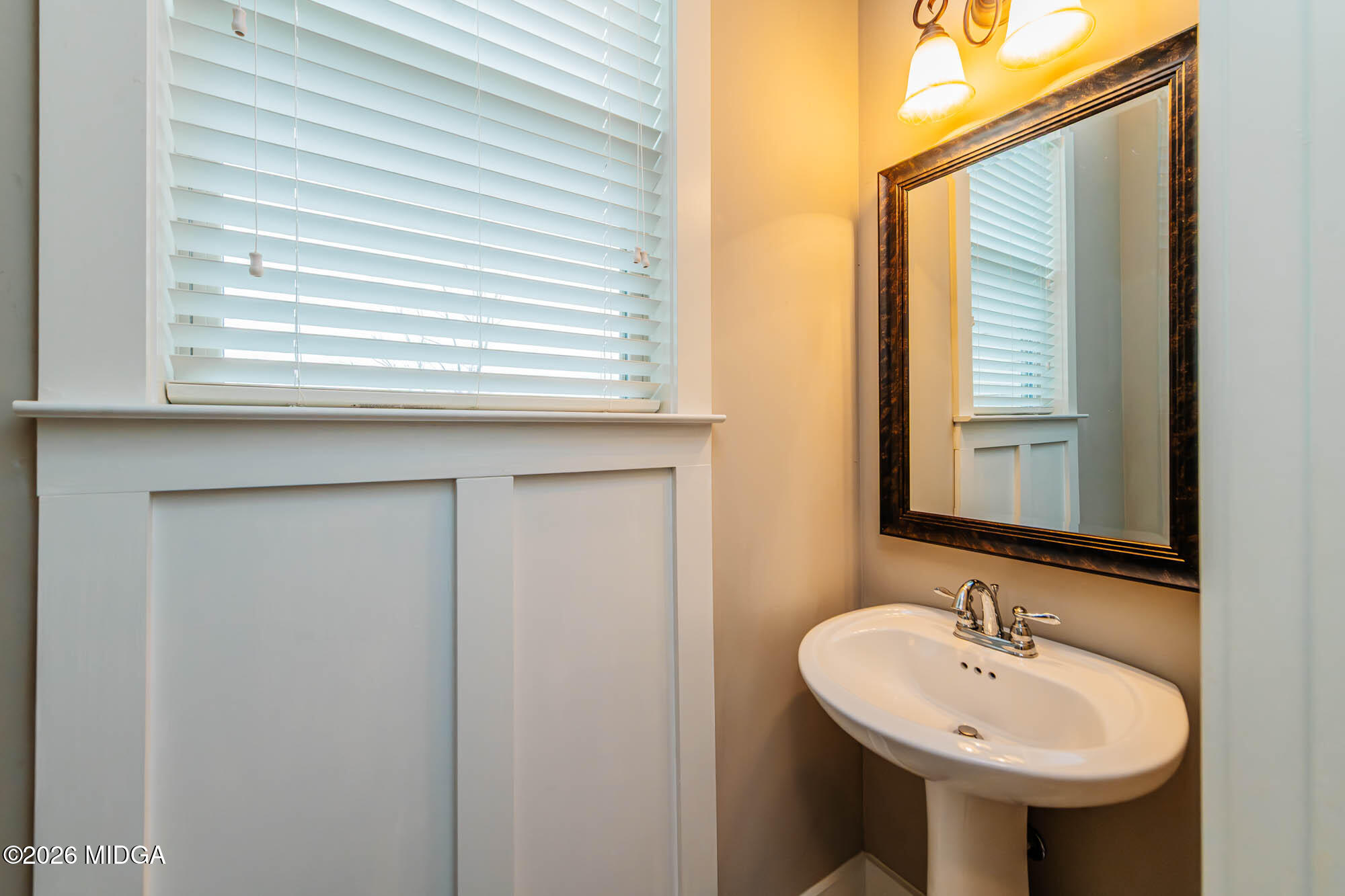 112 Agriculture Lane Perry, GA 31069 - Photo 16 of 40 a bathroom with a sink and a mirror