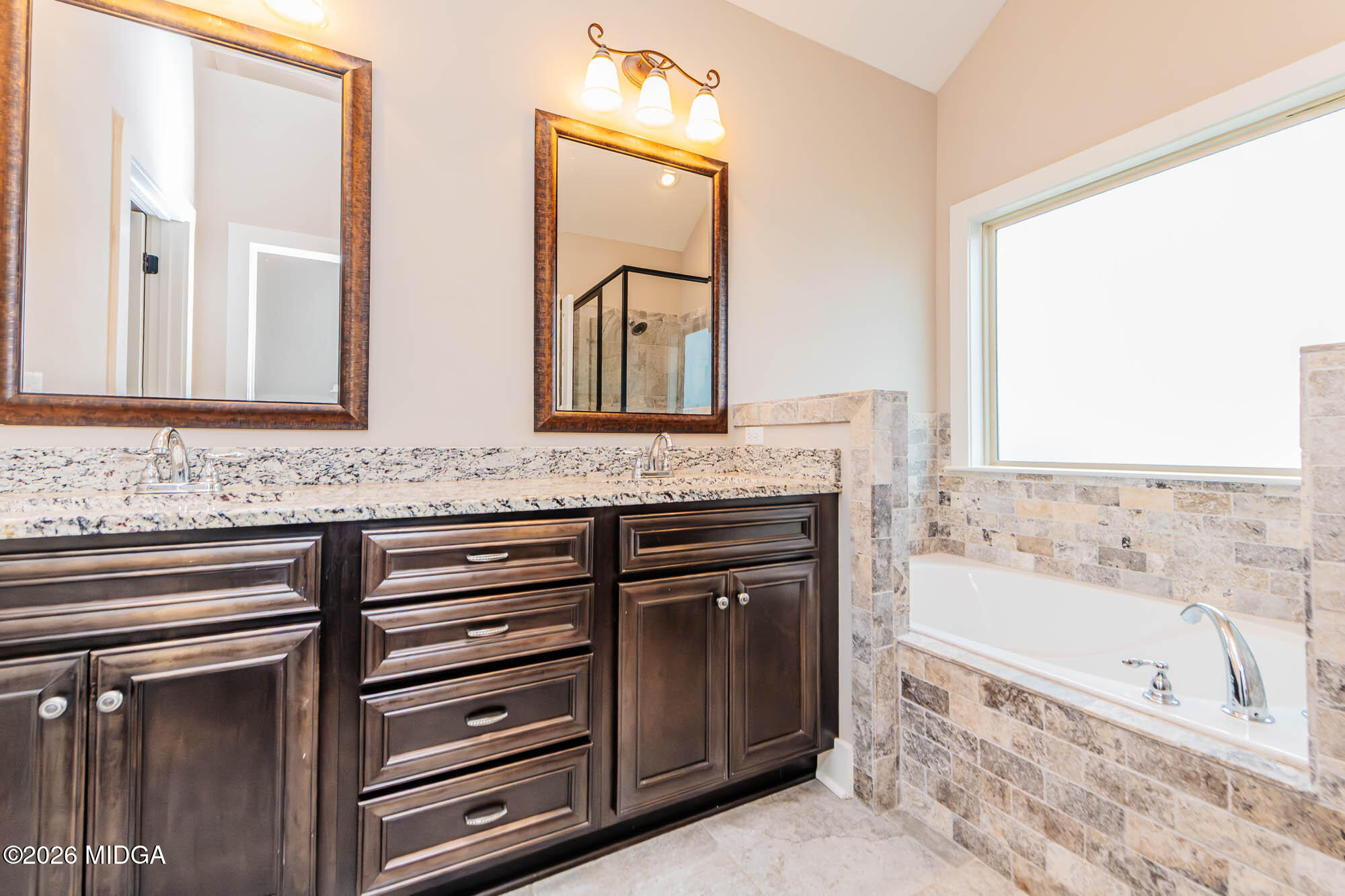 112 Agriculture Lane Perry, GA 31069 - Photo 22 of 40 a bathroom with a granite countertop tub sink and mirror