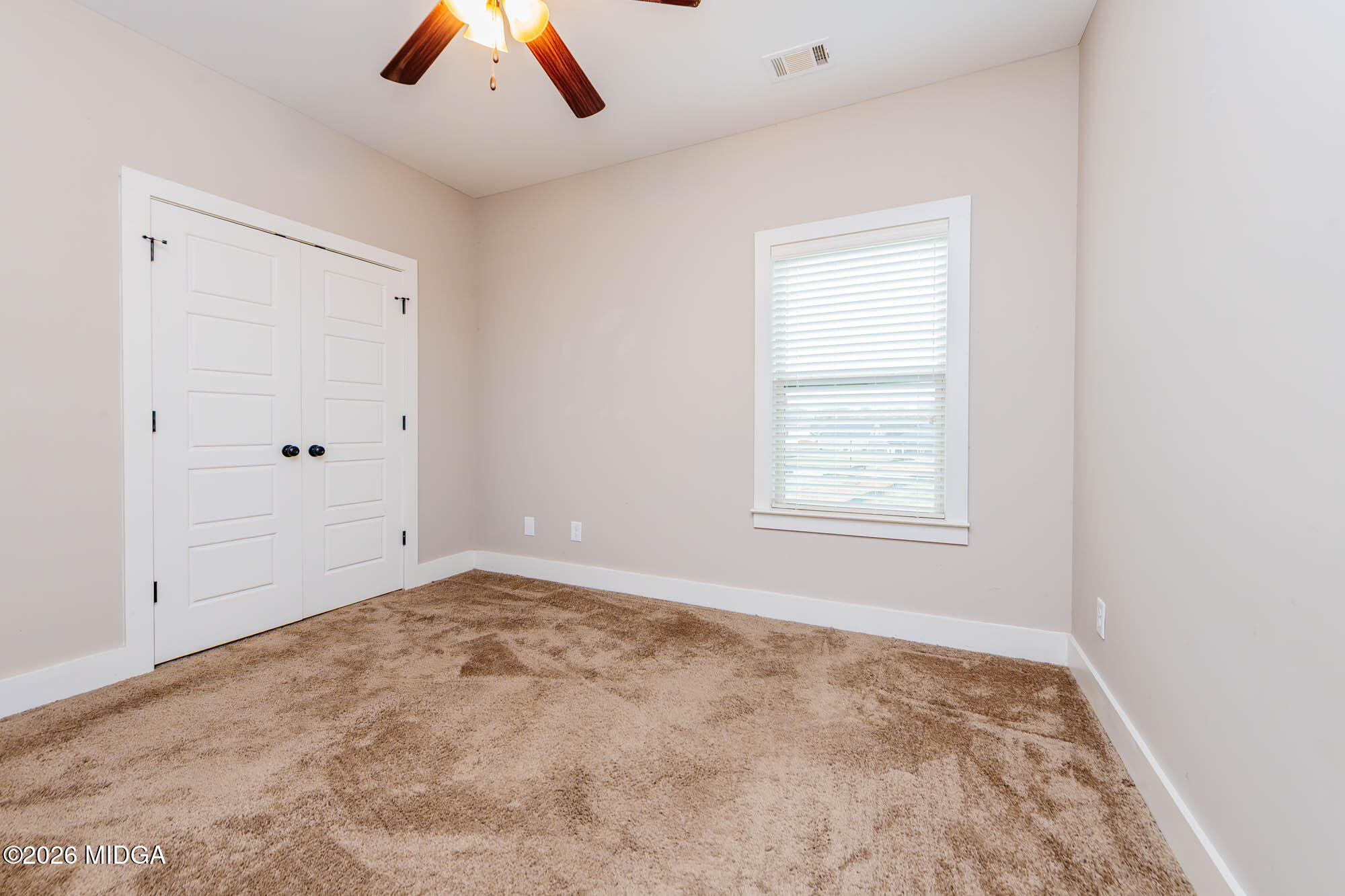 112 Agriculture Lane Perry, GA 31069 - Photo 26 of 40 a view of an empty room with a window