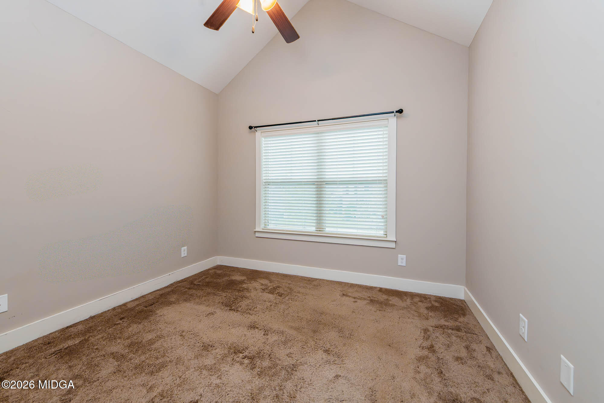 112 Agriculture Lane Perry, GA 31069 - Photo 29 of 40 an empty room with chandelier fan and windows