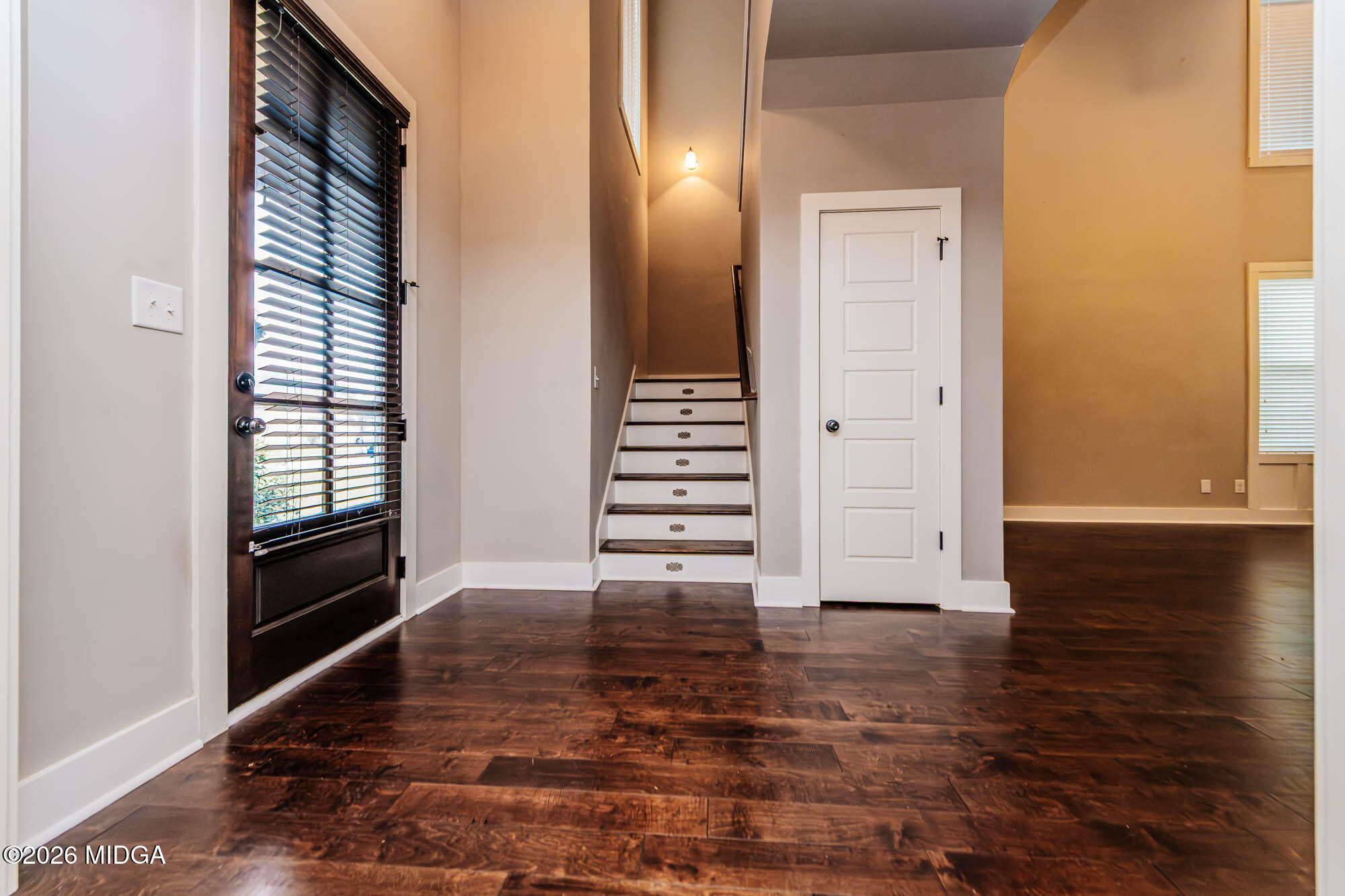 112 Agriculture Lane Perry, GA 31069 - Photo 4 of 40 a view of a hallway with stairs and wooden floor
