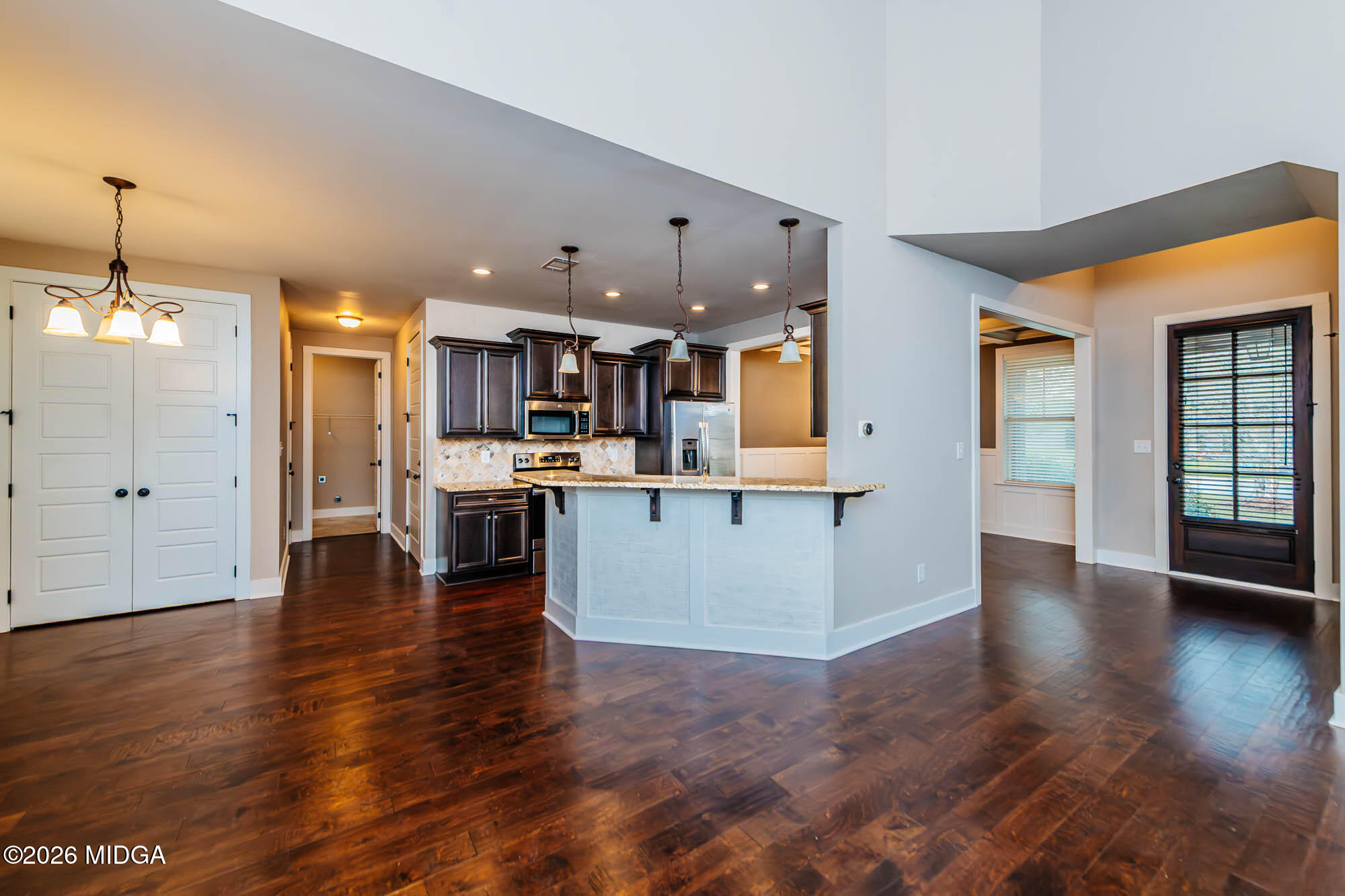 112 Agriculture Lane Perry, GA 31069 - Photo 10 of 40 a view of a kitchen with a sink and an empty room
