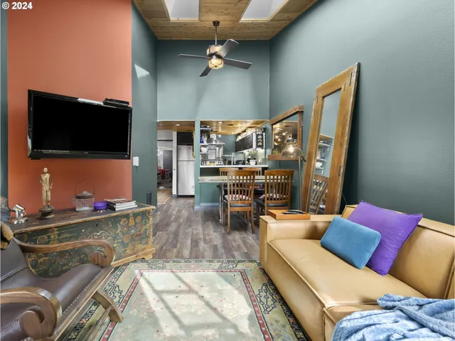 a bedroom with bed and a night stand