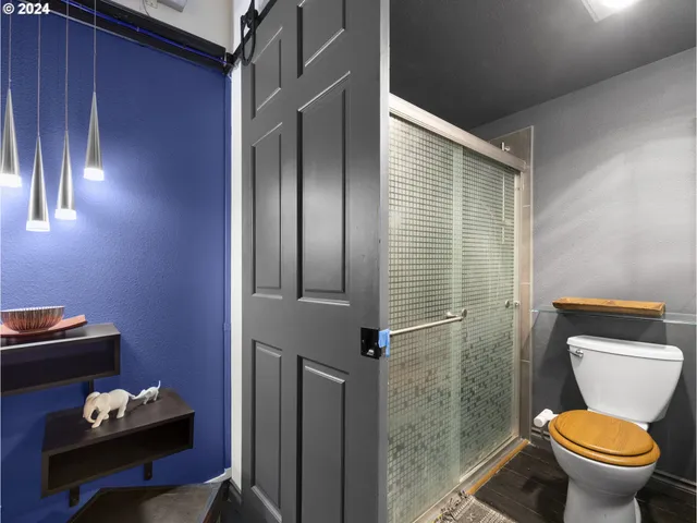 a bedroom with bed and a chandelier