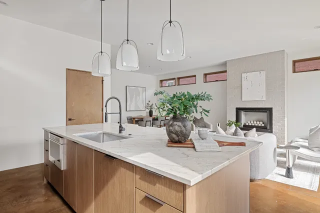 a spacious bathroom with double vanity two mirror and bathtub