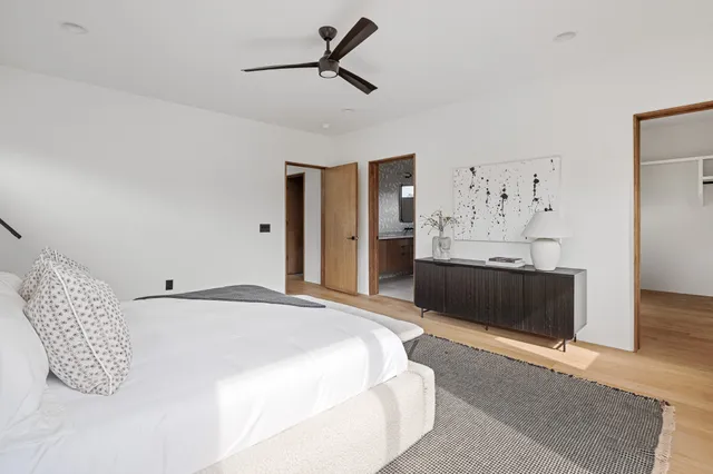 a bathroom with double vanity sinks and a mirror