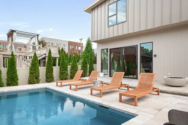 a outdoor space with patio the couches and dining table with garden view