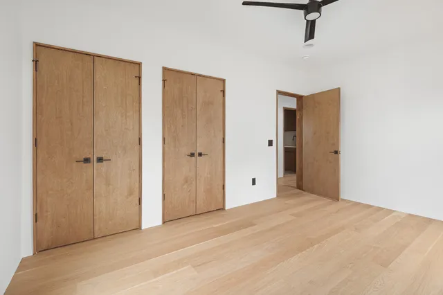 a bathroom with a sink and mirror with toilet