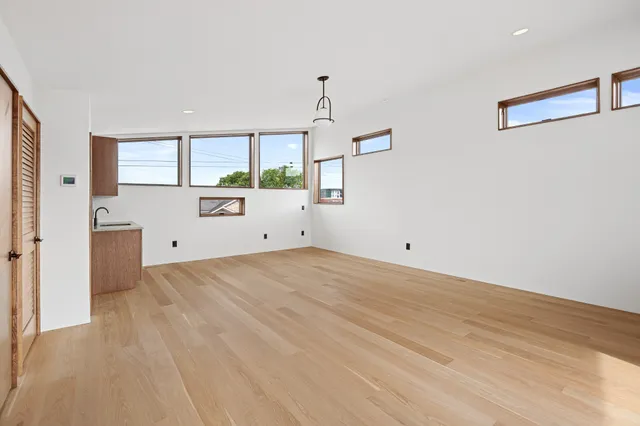 a building outdoor space with patio furniture and potted plants