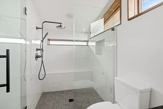 a kitchen with stainless steel appliances a refrigerator and a stove top oven