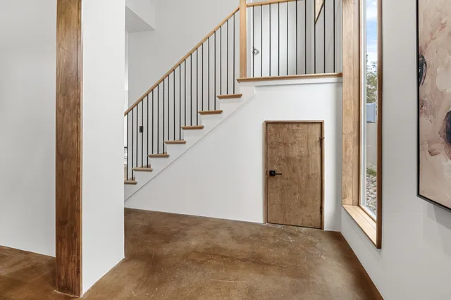 a bathroom with a granite countertop shower sink and mirror