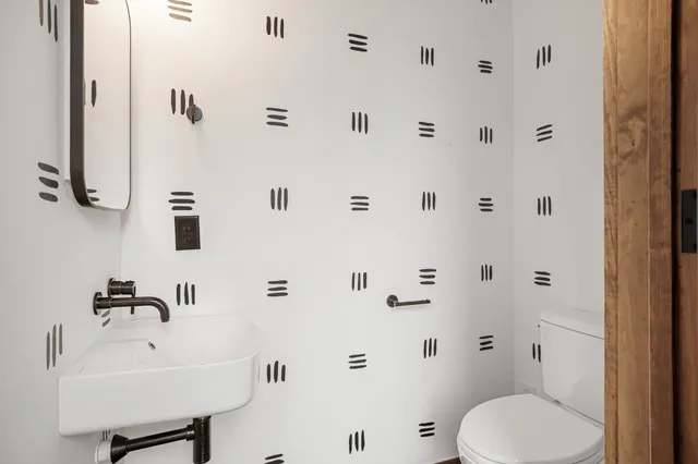 an aerial view of residential houses with outdoor space and street view