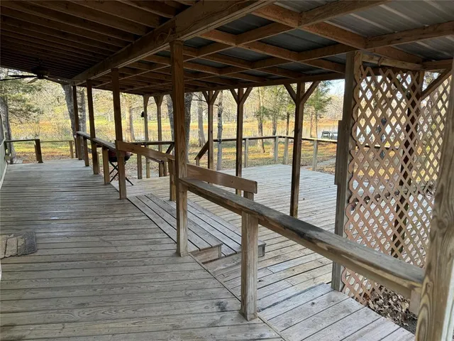 a view of outdoor space with wooden floor and furniture