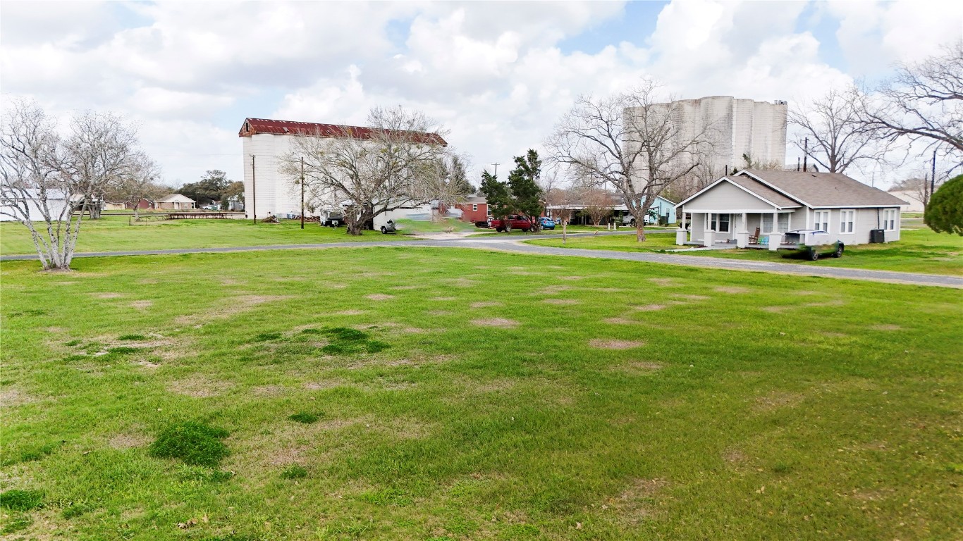 0 4th Street Louise, TX 77455 - Photo 11 of 12 a view of a big house with a big yard and large trees