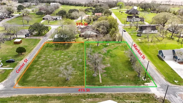 a view of a garden with an outdoor seating